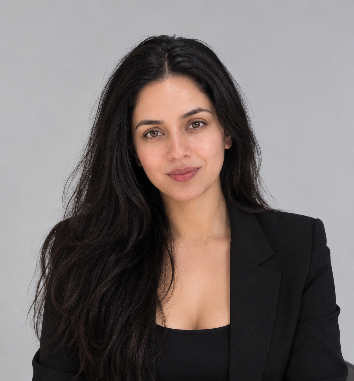 Velnixa — psychology and relationship educator — in a black blazer portrait